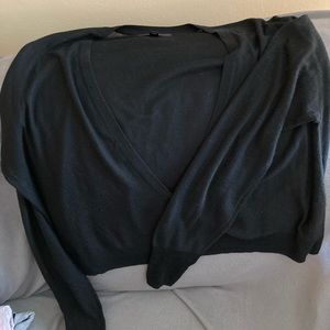 Long sleeved cropped black sweater.